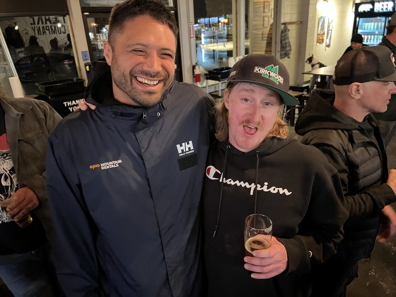 Nick laughing with a friend at a local bar